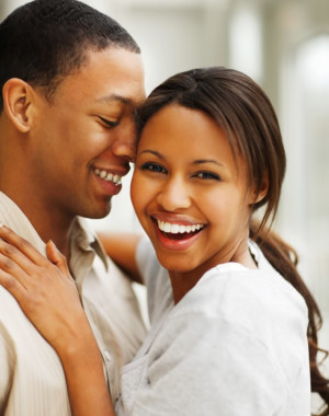 Portrait of a romantic happy young African American couple enjoying
